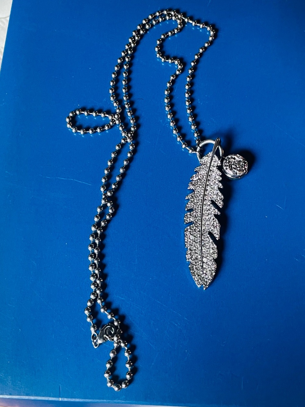 Rhinestone Feather Pendant Necklace in Silver Tone